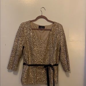 A sequin gold blouse